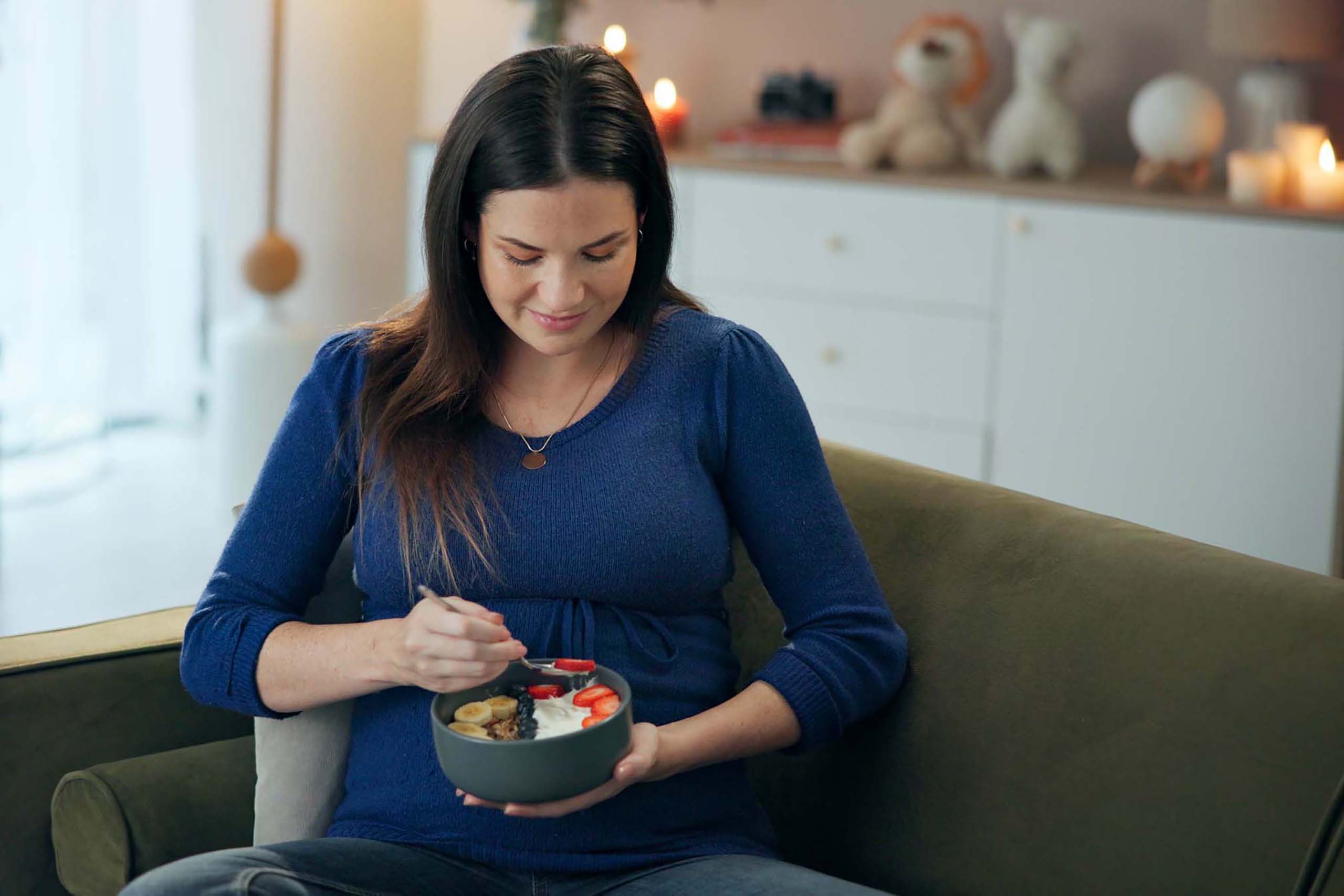 pregnant woman eating a salad