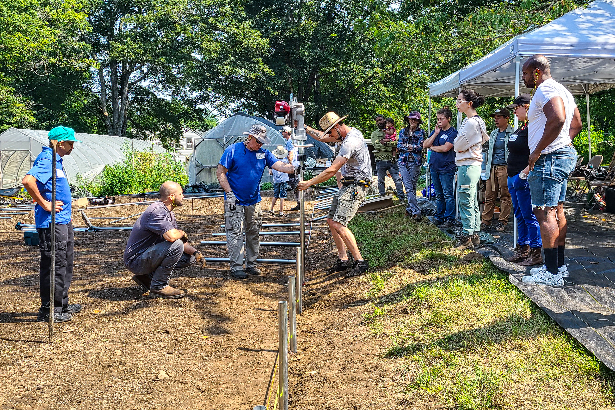 group of people watching a seeding demonstration