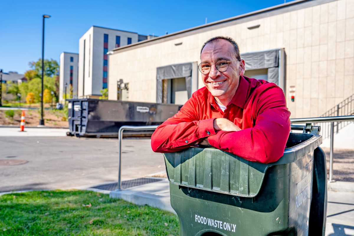 Jackson Somers posing in a compost bin